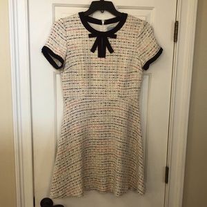 A-line dress. Cream background with black piping multi colored tweed throughout.